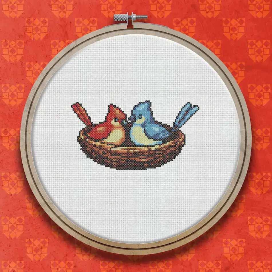 Two small birds, one red and one blue, sitting together in a small brown woven nest on a white background.