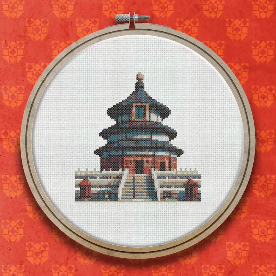 Cross stitch design of the Temple of Heaven featuring a tiered blue circular roof, red columns and walls, and a central staircase set against a white background.