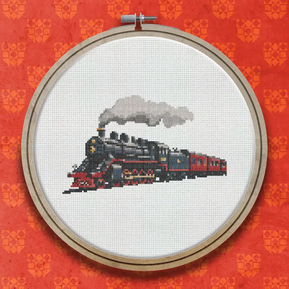 Cross stitch pattern of a black steam locomotive with red and grey detailing, white steam rising from the funnel, set against a pale background.