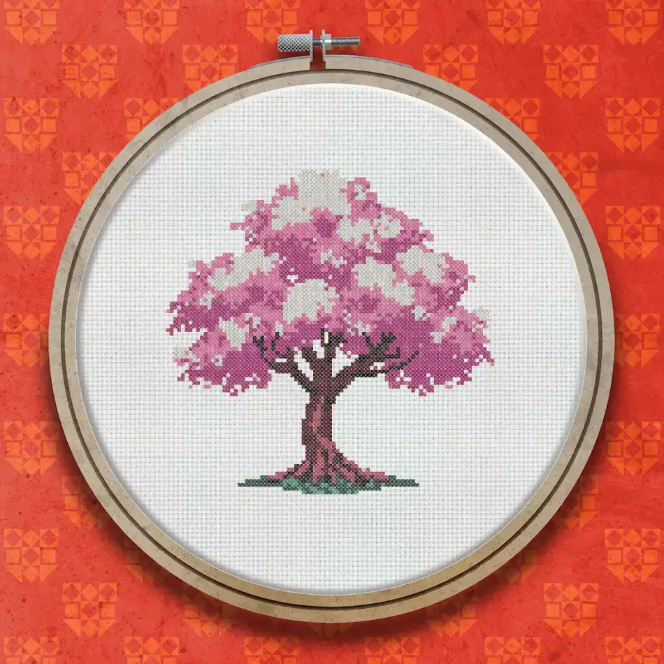 Cross stitch pattern of a cherry tree in full blossom with a dense canopy of pink and rose flowers, a brown gnarled trunk and darker roots at the base.
