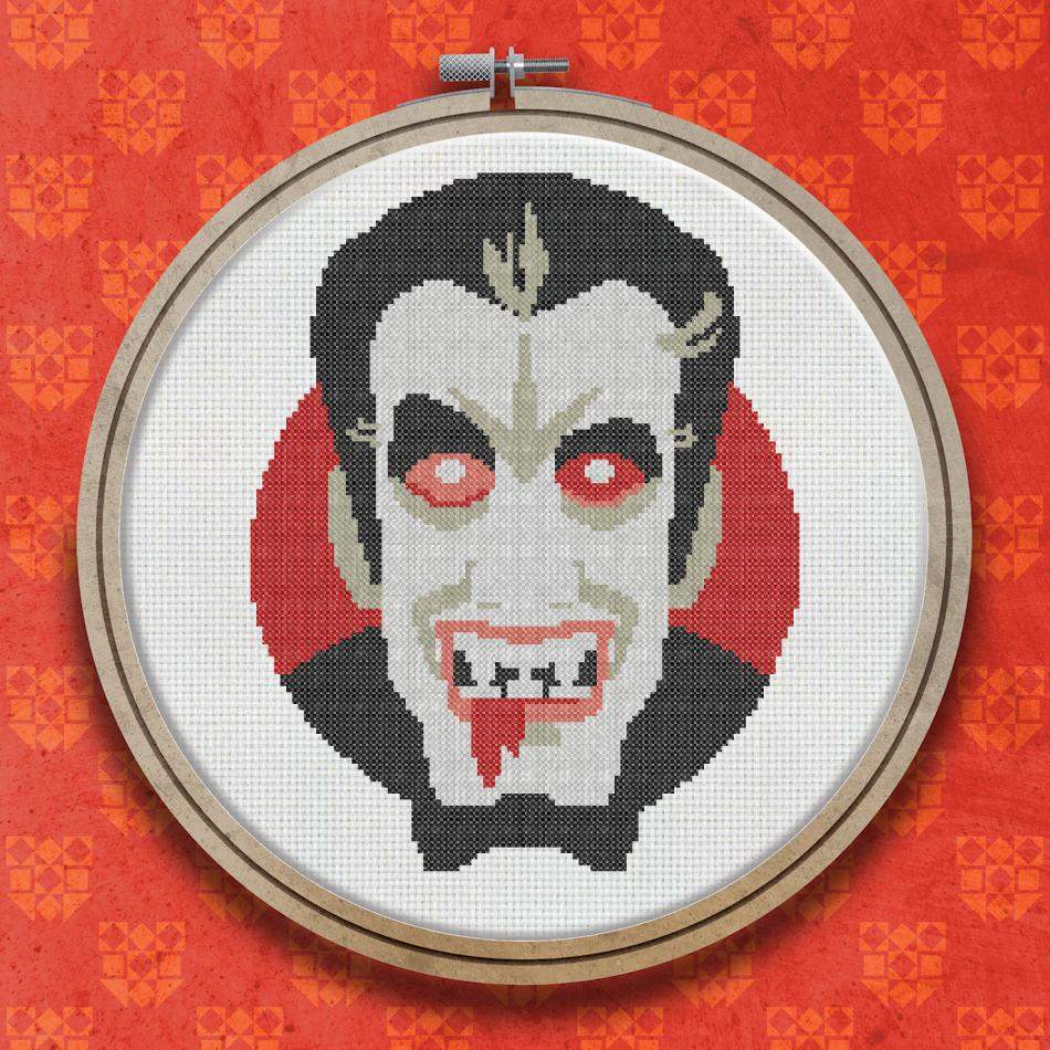 Cross stitch design of a vampire face with pale skin, dark hair, red glowing eyes, fangs and blood, on a red and black circular background.