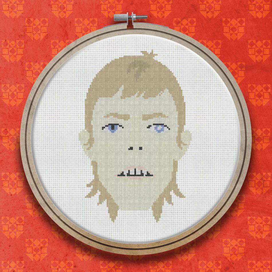 Cross stitch portrait of a pale-faced figure with blonde hair, blue eyes, and parted lips, stitched in a limited neutral and skin-tone palette.