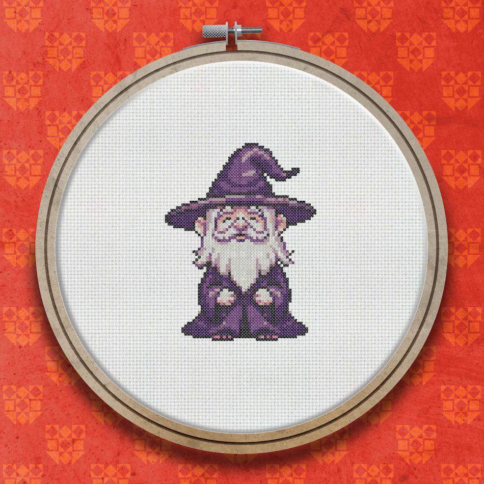 Cross stitch design of a small robed wizard with a long white beard wearing a tall pointed purple hat and purple robes.