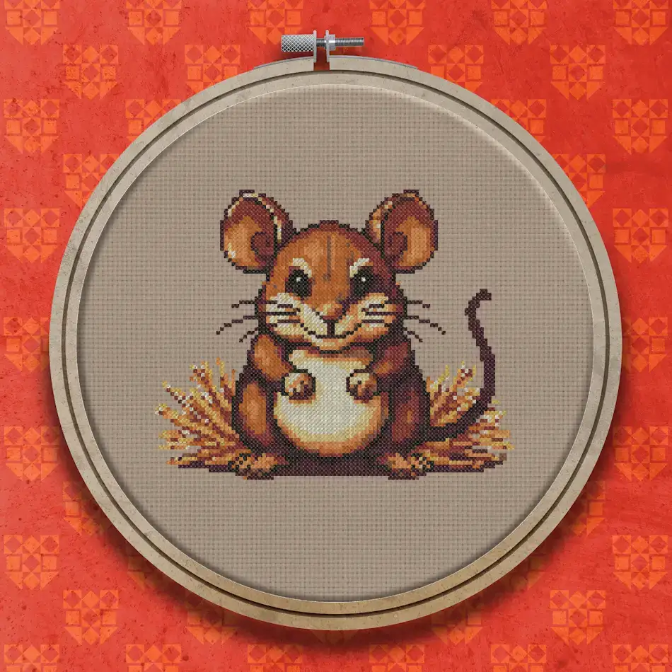 Pixel art style cross stitch design of a brown harvest mouse sitting upright among golden straw, with a pale cream belly and dark eyes.