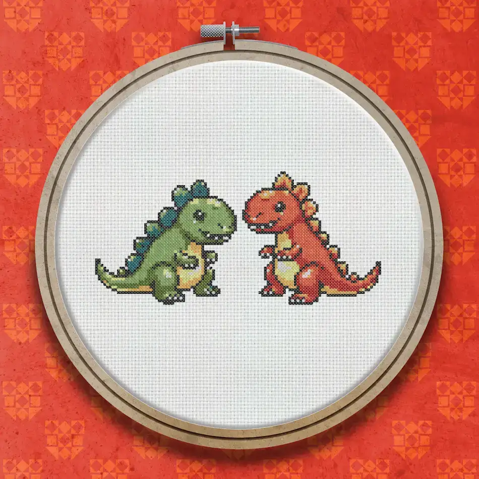 Two small cartoon-style dinosaurs facing each other, one green and one orange-red, each with a rounded body, short arms and a friendly expression.