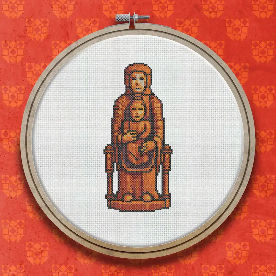 Cross stitch design of a robed Madonna seated on a throne, holding the Christ Child on her lap, worked in warm browns and terracotta tones.