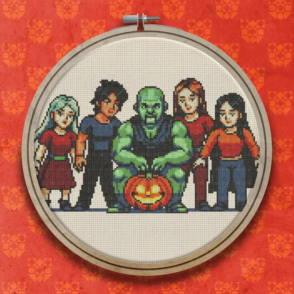 Green ogre standing with four people of varied hair and clothing colours, around a glowing carved pumpkin, in cross stitch style