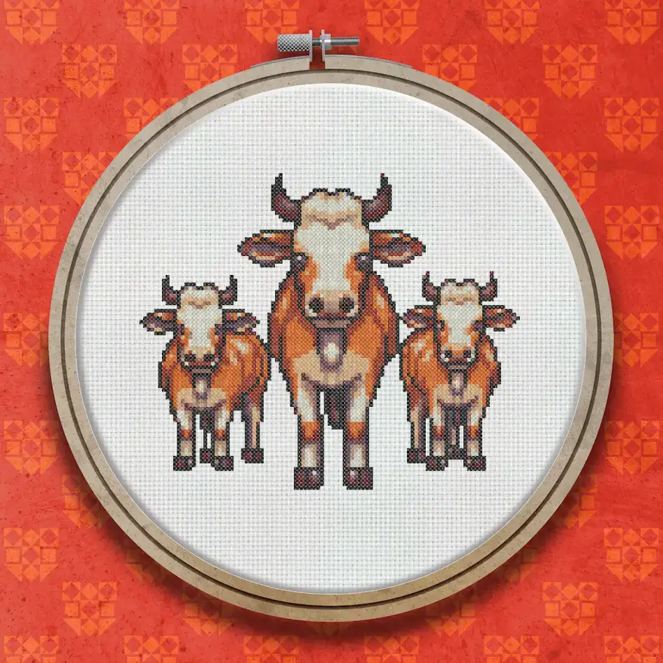Cross stitch design showing three brown and cream cows standing together, facing forward, with simple facial markings and matching collars.