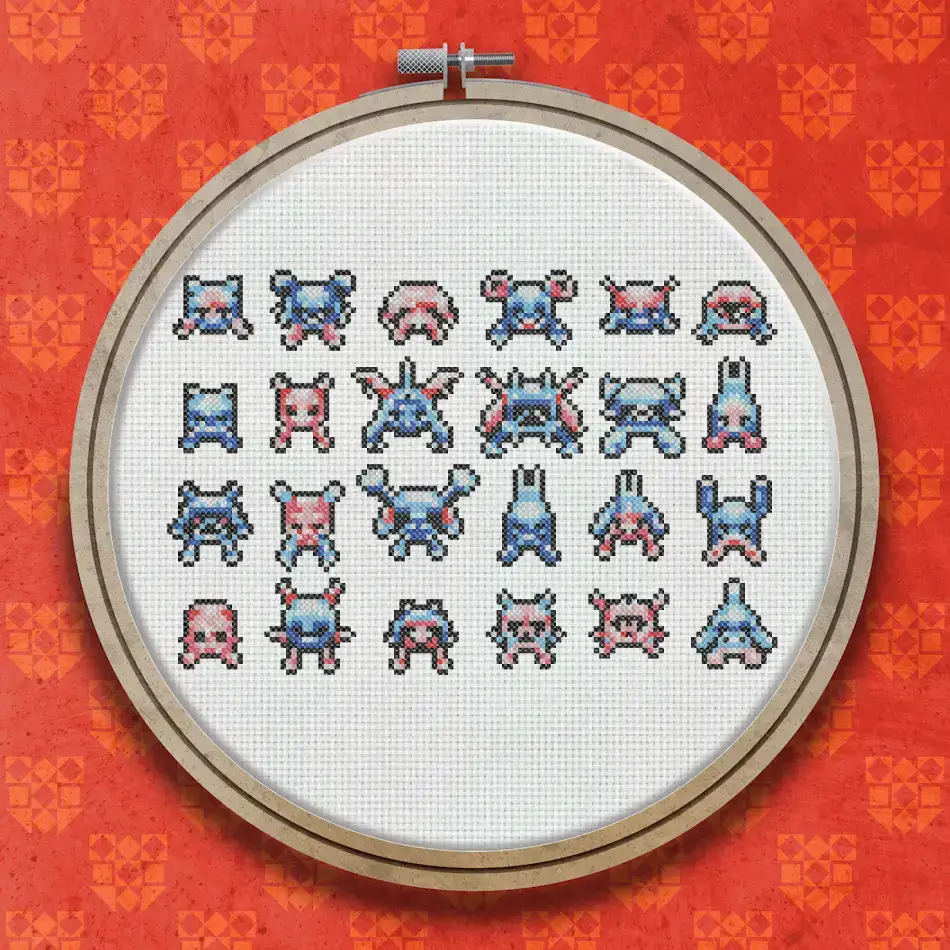 A cross stitch pattern showing multiple rows of retro arcade alien characters in red, blue and white, including crab-shaped, squid-shaped and helmet-shaped invaders with small spaceship figures.