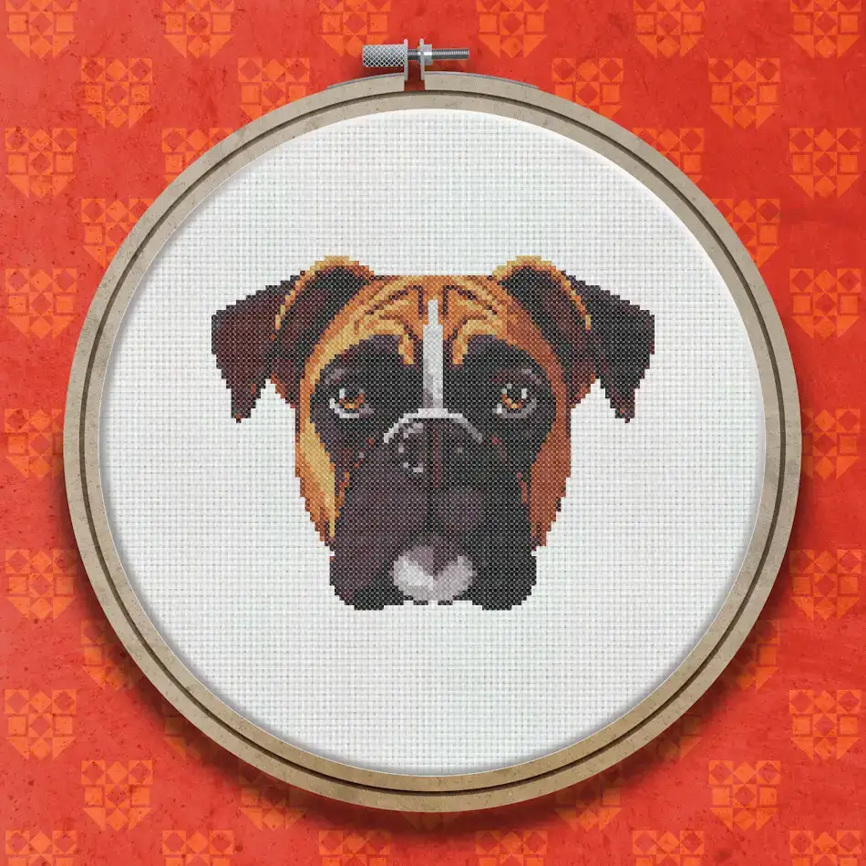 Cross stitch portrait of a Boxer dog with fawn and white markings, dark eyes, a black muzzle, and a warm direct gaze on a white background.