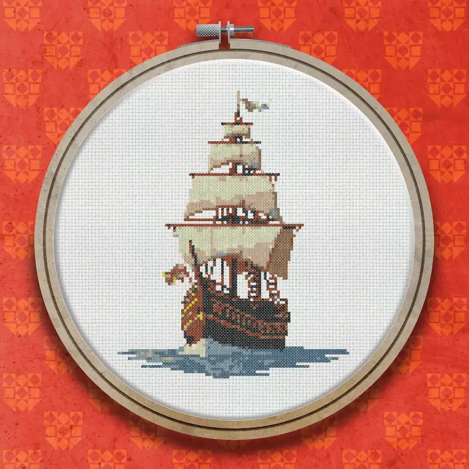 Cross stitch design of a tall sailing ship with cream sails and a dark hull moving through blue-green water against a light sky.