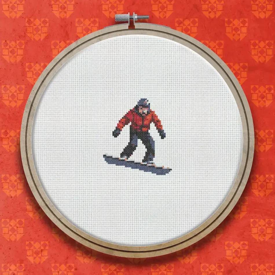 Cross stitch design of a snowboarder wearing a red jacket and dark trousers, riding a snowboard facing left against a light background.