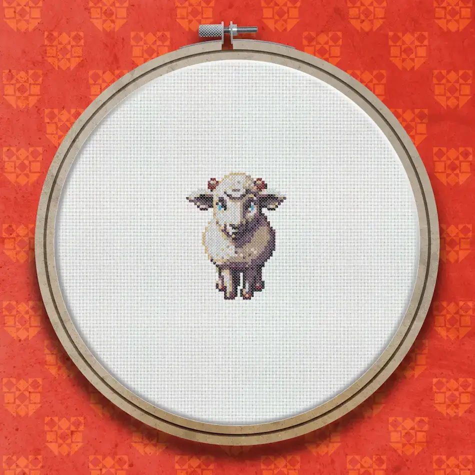 Cross stitch design of a small white woolly sheep standing facing forward, with a cream and grey fleece, small hooves and a gentle face.
