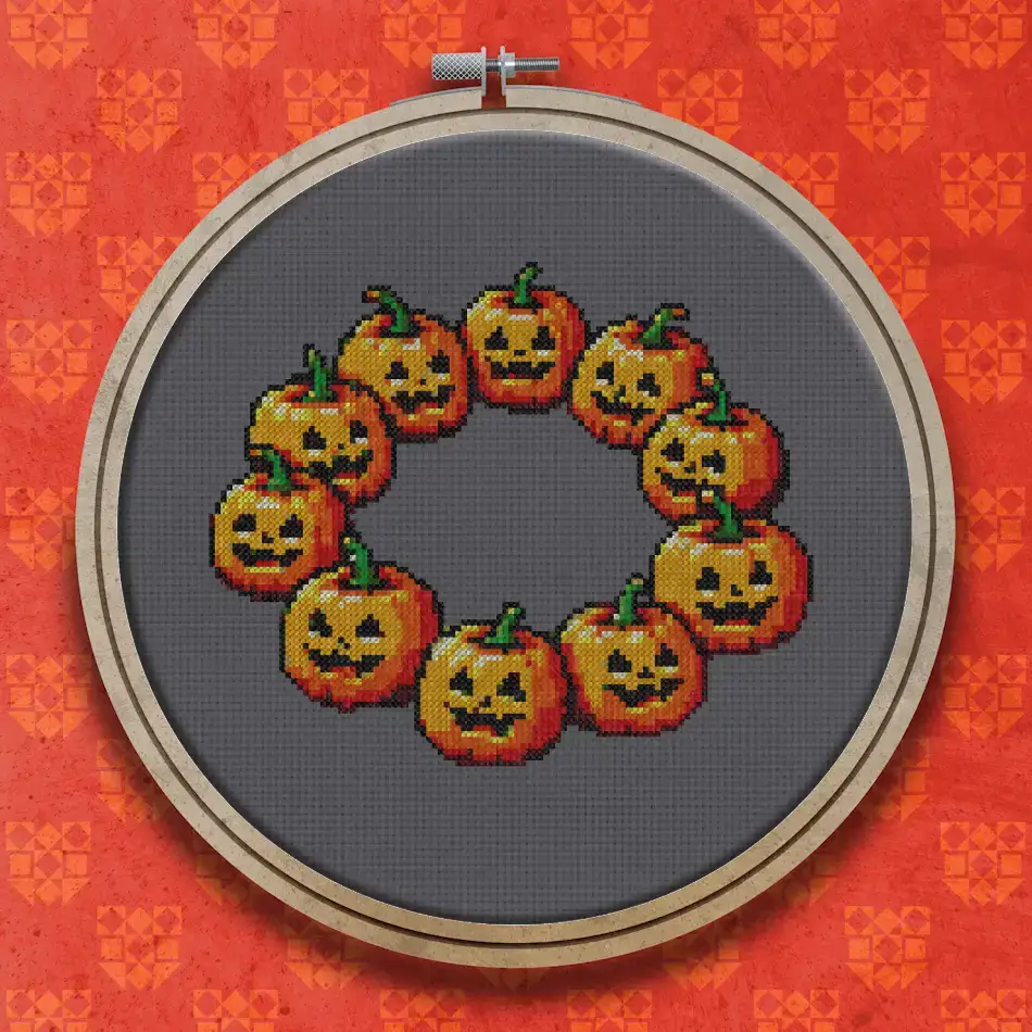 Ring of ten orange carved pumpkins with grinning faces and small green stalks arranged in a circular wreath