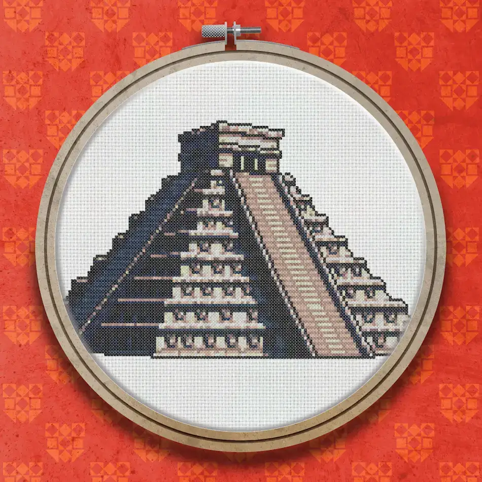 Cross stitch design of the stepped Mayan pyramid of Chichen Itza, shown in warm sandy and brown tones with a grand central staircase.