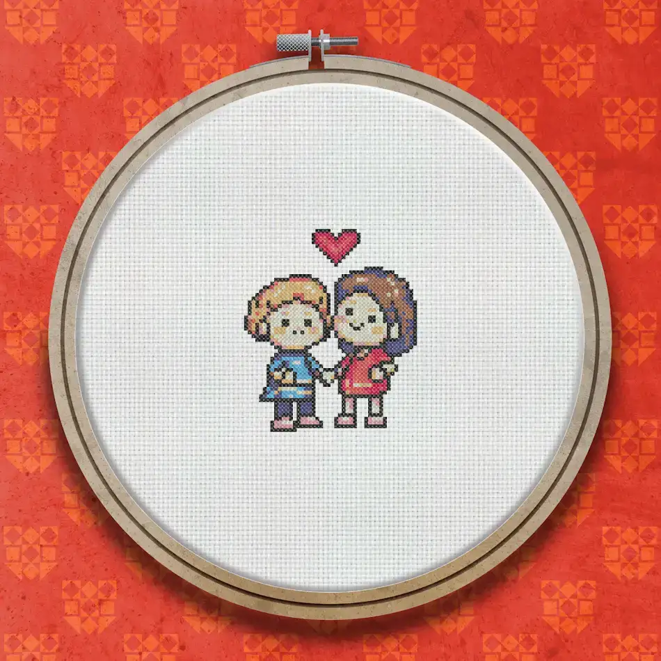 Cross stitch design of a boy and girl standing together facing each other, with a large red heart above them, on a white background.