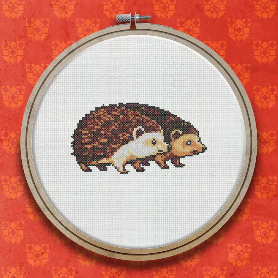 Cross stitch pattern of a hedgehog with dark brown spines and a lighter brown face and underside, shown in profile walking to the left.