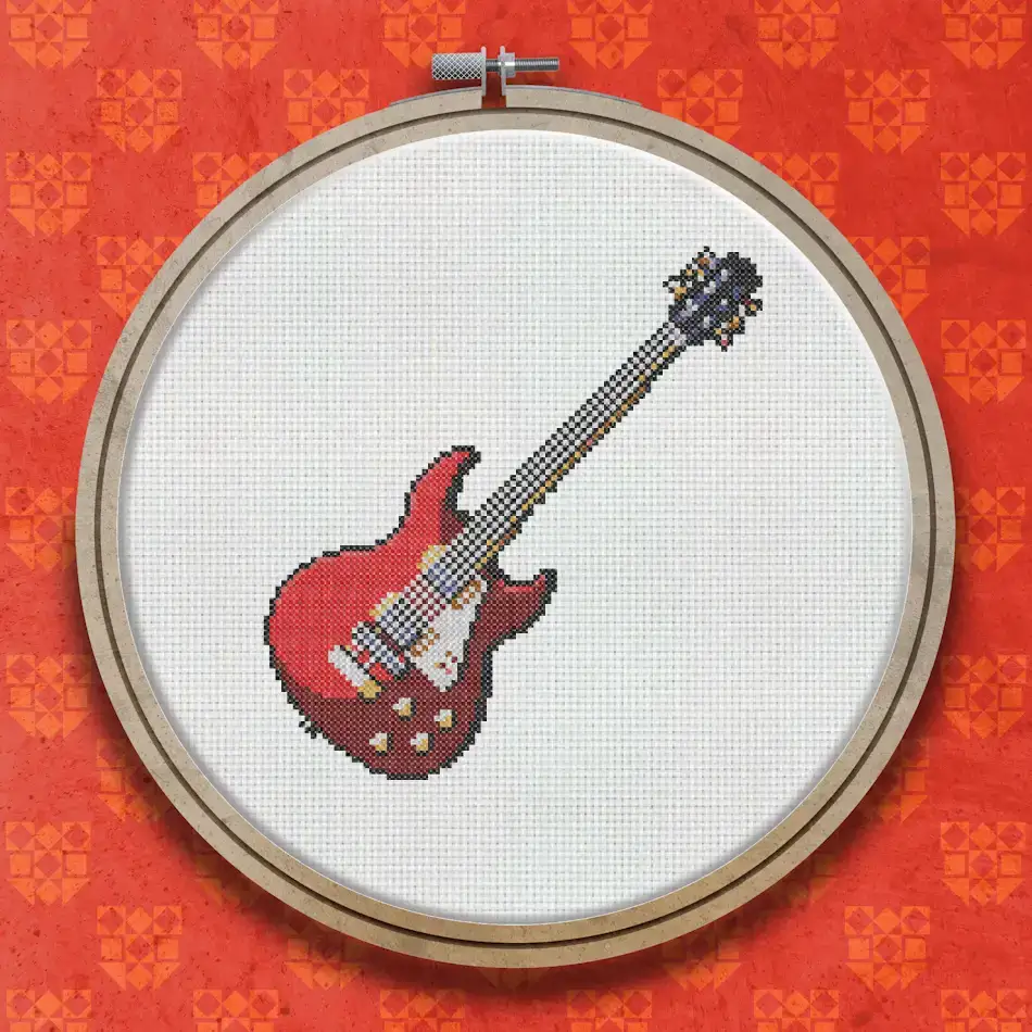 Cross stitch design of a red electric guitar with a dark neck, gold tuning pegs, and visible strings on a white background.
