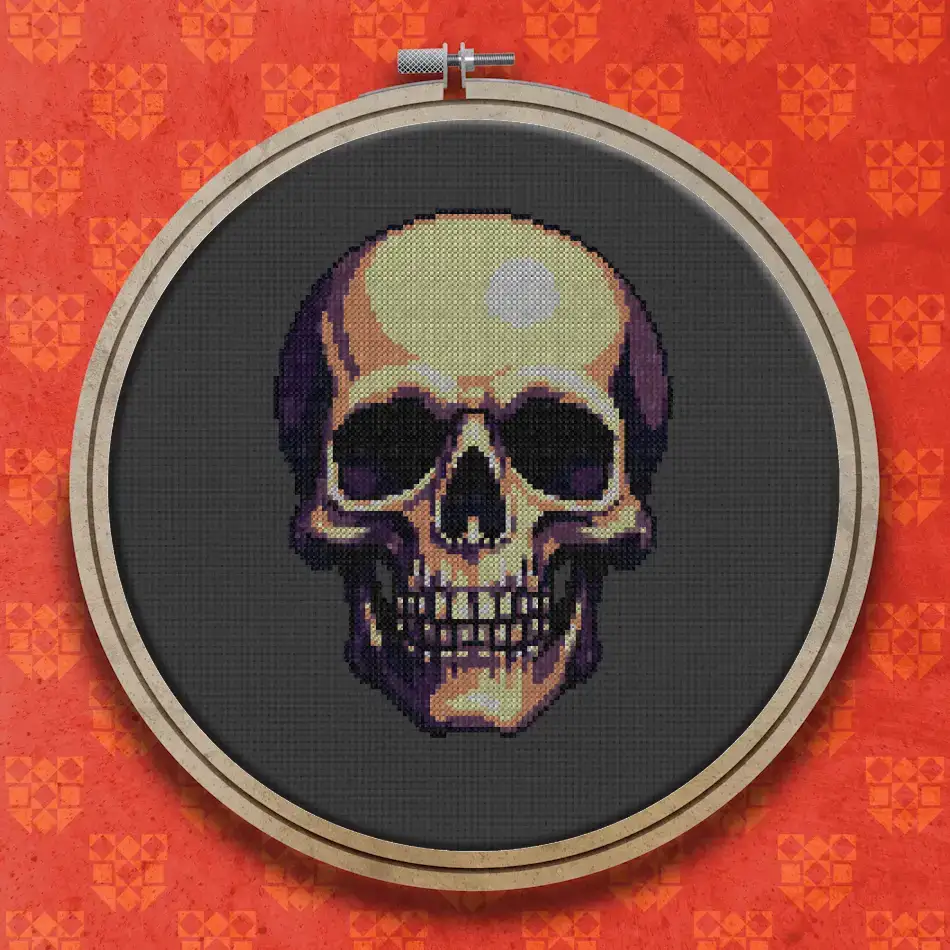 Front view of a human skull in ivory and golden brown shades with dark hollow eye sockets, nose cavity and teeth, on a dark background