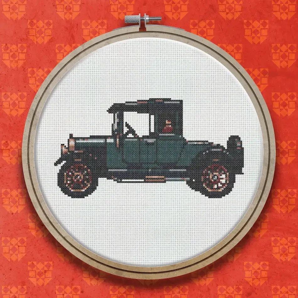 Cross stitch design of a vintage dark teal motor car with an enclosed cab, spoke wheels, running boards, and a spare tyre, shown in side profile.