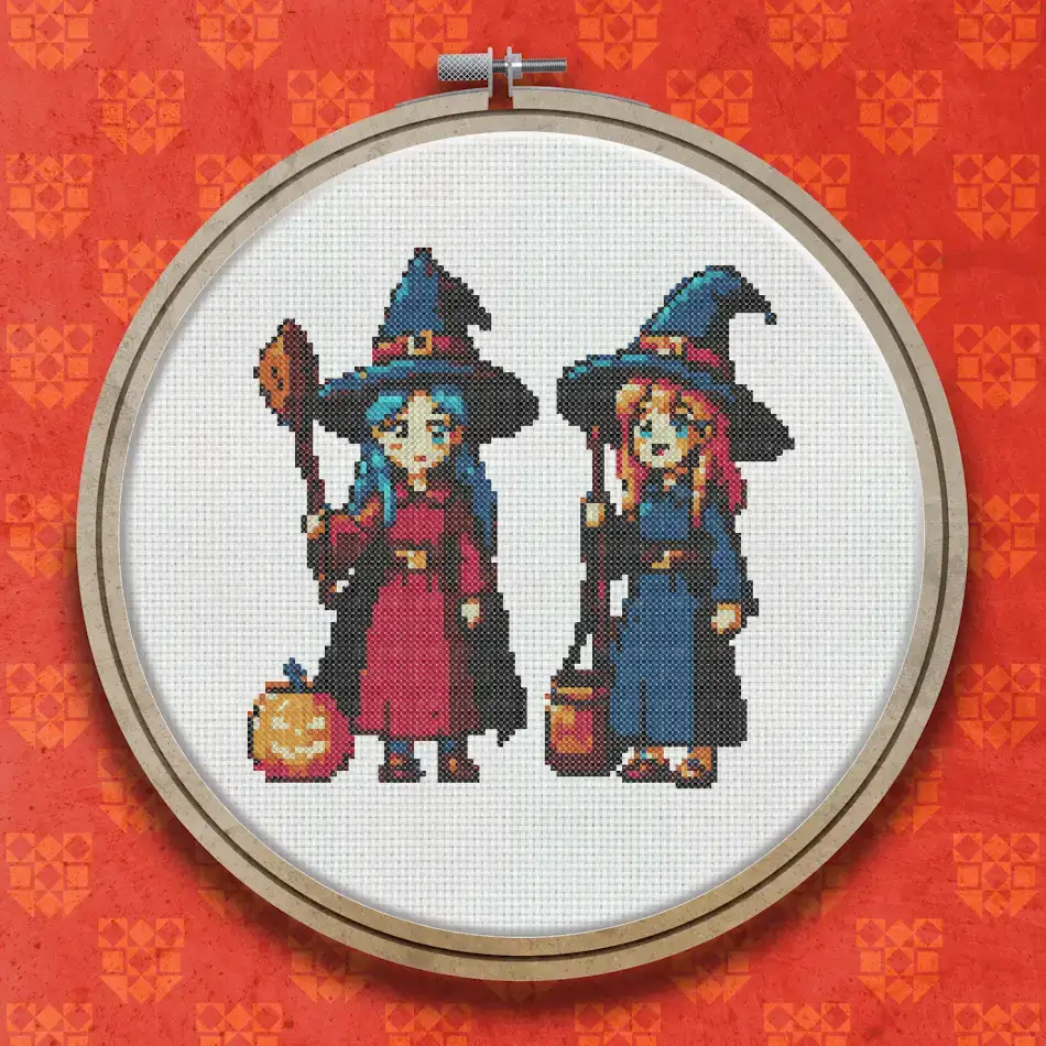 Two Halloween witches in pointed hats, one in red and one in black, holding broomsticks with a cauldron and orange pumpkins at their feet.