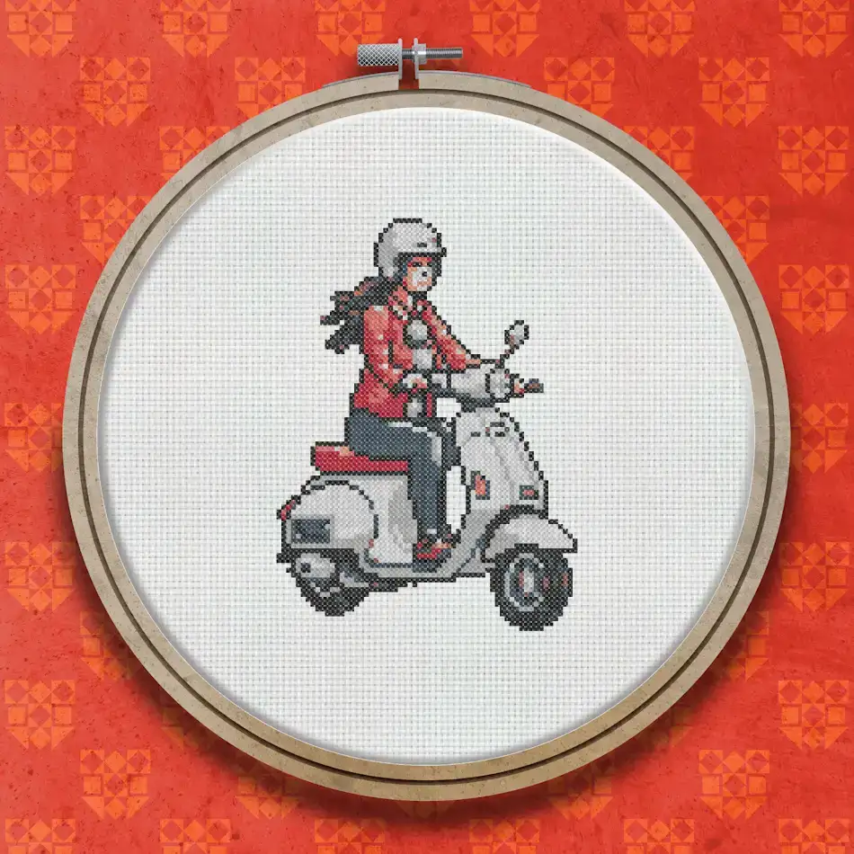 Pixel-style cross stitch design of a person in a red jacket and helmet riding a cream vintage scooter, facing right.