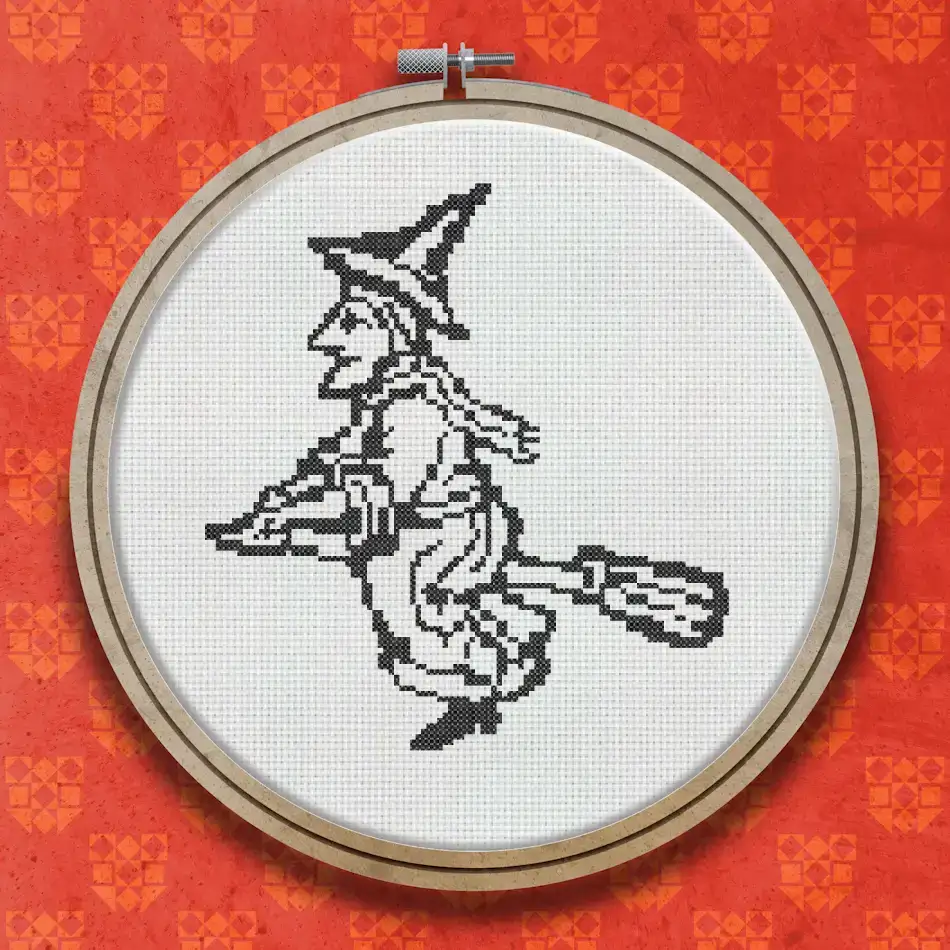 Cross stitch design of a witch in pointed hat and robes riding a broomstick, rendered in black thread in a vintage woodcut illustration style.