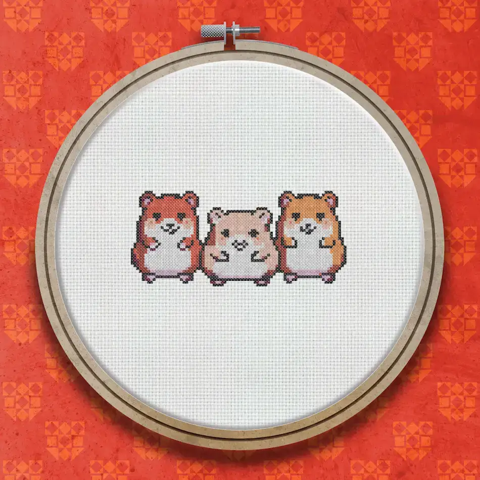 Three small hamsters stitched side by side, one brown and white, one pale golden, one light brown, all with rosy cheeks and friendly expressions.