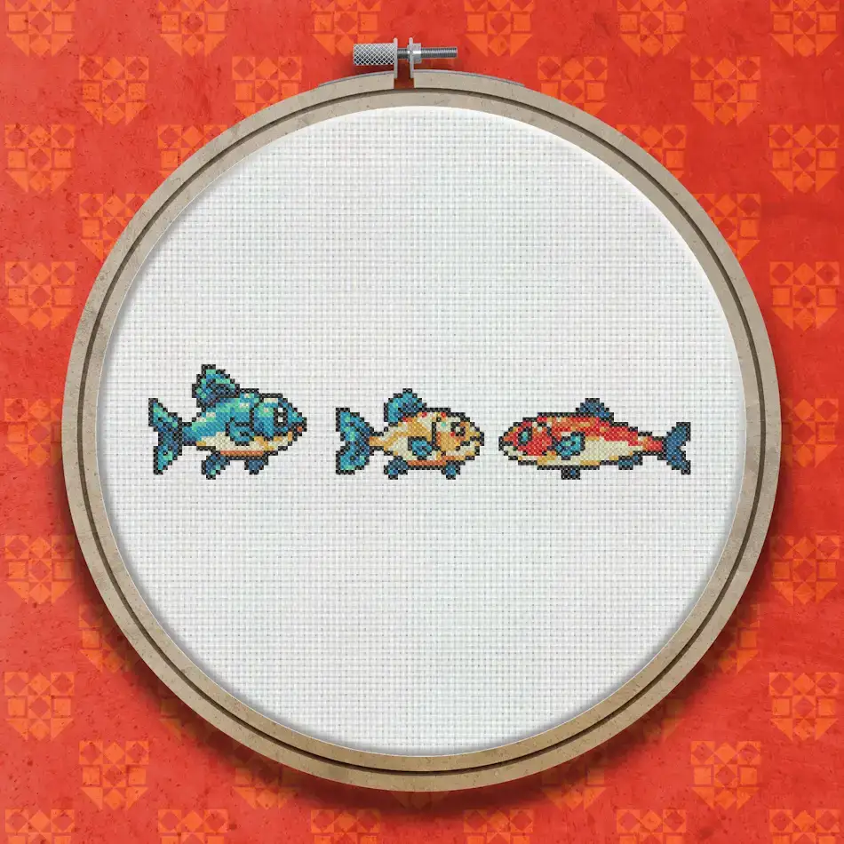 Three small colourful fish in a horizontal row: a blue and orange fish, a plain orange fish, and a red fish with orange fins.